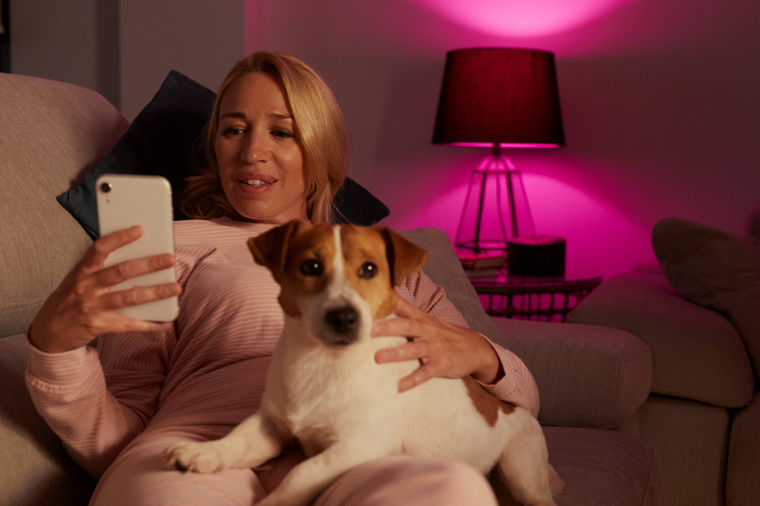 Woman using the PhoneWatch app on their iPhone